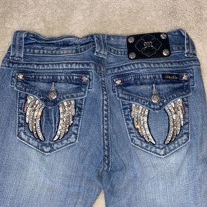 Miss Me ankle skinny jeans with angel wing pockets.